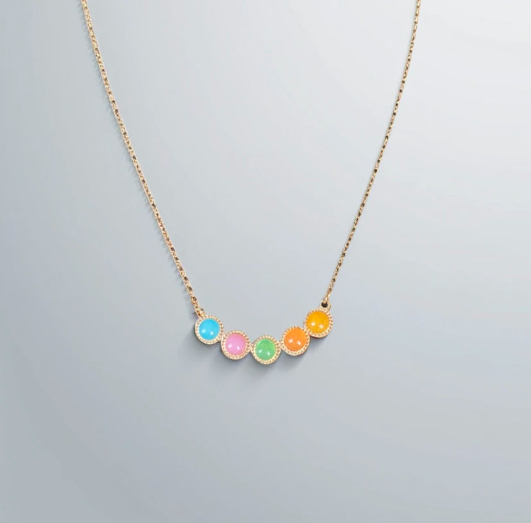 colourful pendant necklace on white background