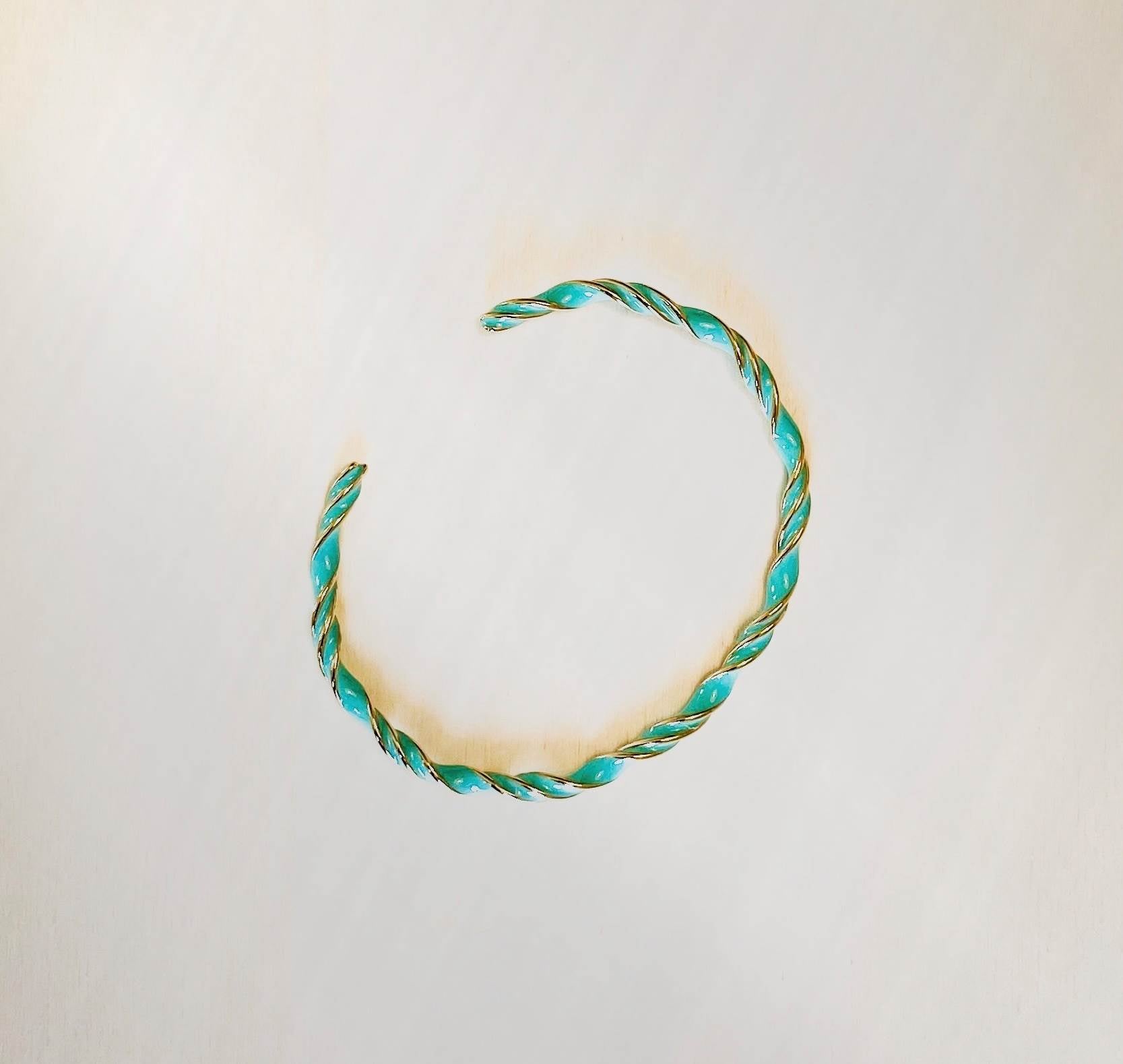 turquoise and gold enamel bangle for females on plain white background